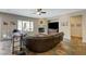 Living room offering tile floors, fireplace, large couch and windows at 2124 Pont National Dr, Henderson, NV 89044