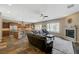 Expansive living room showing kitchen, fireplace and pool with mountain views at 2124 Pont National Dr, Henderson, NV 89044