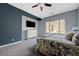 Spacious main bedroom with mountain views, large window, and a contemporary ceiling fan at 2124 Pont National Dr, Henderson, NV 89044