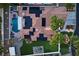 Aerial view showcasing a pool, putting green, solar panels and a backyard entertainment area at 219 Windsong Dr, Henderson, NV 89074