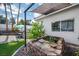 Backyard water feature and outdoor patio, with seating and views of a synthetic lawn at 219 Windsong Dr, Henderson, NV 89074