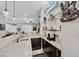 Stylish home bar area connects to open living space with countertop and display shelves at 219 Windsong Dr, Henderson, NV 89074