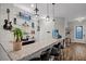 Home bar area with custom shelving, countertop, and seating at 219 Windsong Dr, Henderson, NV 89074