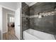 Bathroom featuring a tub, shower, and built-in niche with decorative accent tiles at 219 Windsong Dr, Henderson, NV 89074