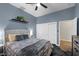 Comfortable bedroom with gray-blue walls and a double door closet at 219 Windsong Dr, Henderson, NV 89074