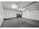 Spacious garage with epoxy floors and plenty of storage cabinets at 219 Windsong Dr, Henderson, NV 89074