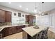 Bright kitchen with a large island, stainless steel appliances, and a window overlooking the backyard at 219 Windsong Dr, Henderson, NV 89074