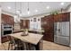 Spacious kitchen with an island, stainless steel refrigerator, and plenty of cabinet space at 219 Windsong Dr, Henderson, NV 89074
