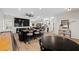 Open concept living area with bar, game table, media center, and comfortable seating at 219 Windsong Dr, Henderson, NV 89074