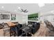 Open-concept living area featuring a large TV and comfortable couches for relaxing at 219 Windsong Dr, Henderson, NV 89074