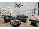 Open-concept living area with comfortable seating and a game table perfect for entertainment at 219 Windsong Dr, Henderson, NV 89074