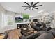 Spacious living room featuring a large TV, comfortable seating, and stylish bar area at 219 Windsong Dr, Henderson, NV 89074