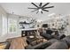 Spacious living room featuring a large TV, comfortable seating, and stylish bar area at 219 Windsong Dr, Henderson, NV 89074