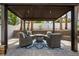 Outdoor patio with a pergola, fire pit, and comfortable seating for entertaining at 219 Windsong Dr, Henderson, NV 89074