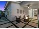 Inviting patio area with a fire pit, comfortable seating, and well-manicured lawn, offering a relaxing atmosphere at 219 Windsong Dr, Henderson, NV 89074