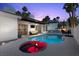 Stunning pool and spa combo with lounge seating and outdoor living space at 219 Windsong Dr, Henderson, NV 89074
