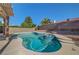 This backyard features a sparkling pool, spa and privacy landscaping at 2711 Briarcliff Ave, Henderson, NV 89074