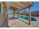 A refreshing backyard pool is partly shaded by a wooden pergola at 2711 Briarcliff Ave, Henderson, NV 89074