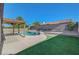 This backyard features a pool, spa and outdoor living space at 2711 Briarcliff Ave, Henderson, NV 89074