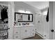 A clean and bright bathroom features a glass-enclosed shower and single sink at 2711 Briarcliff Ave, Henderson, NV 89074