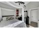 Bedroom with a four-poster bed, modern decor, and dark wood floors at 2711 Briarcliff Ave, Henderson, NV 89074