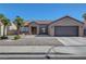 Charming single-story home with a two-car garage, mature landscaping, and a tile roof at 2711 Briarcliff Ave, Henderson, NV 89074