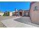 Charming exterior view featuring desert landscaping, a tile roof, and a two-car garage at 2711 Briarcliff Ave, Henderson, NV 89074