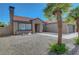 Charming single-story home with desert landscaping, a tile roof, and a two-car garage at 2711 Briarcliff Ave, Henderson, NV 89074