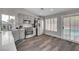 Modern kitchen features grey cabinets, stainless steel appliances, hardwood floors and backyard views at 2711 Briarcliff Ave, Henderson, NV 89074
