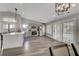 Spacious kitchen with grey cabinets, stainless steel appliances, hardwood floors and a large island at 2711 Briarcliff Ave, Henderson, NV 89074