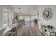 Bright, open-concept living room boasts hardwood floors, modern decor, and seamless flow to the kitchen at 2711 Briarcliff Ave, Henderson, NV 89074