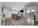 Inviting living room features a vaulted ceiling, fireplace, and stylish gray couch at 2711 Briarcliff Ave, Henderson, NV 89074