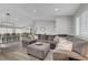 Bright living room featuring a comfortable sectional sofa, wood floors, and recessed lighting at 2711 Briarcliff Ave, Henderson, NV 89074