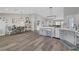 Open living space features a dining area and modern kitchen with stainless steel appliances at 2711 Briarcliff Ave, Henderson, NV 89074
