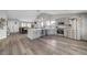 Open living space features a modern kitchen, dining area, and living room with hardwood floors at 2711 Briarcliff Ave, Henderson, NV 89074