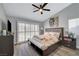 Bright and airy main bedroom with a ceiling fan and dark wood floors at 2711 Briarcliff Ave, Henderson, NV 89074