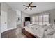 This main bedroom features natural light, wood floors and a ceiling fan at 2711 Briarcliff Ave, Henderson, NV 89074