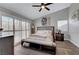 Bright and airy main bedroom with a ceiling fan and dark wood floors at 2711 Briarcliff Ave, Henderson, NV 89074