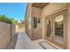 French doors open to a patio with desert landscaping and a privacy wall at 2711 Briarcliff Ave, Henderson, NV 89074