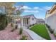 Charming backyard features a small casita, an artificial lawn, and thoughtful landscaping at 2873 Knoxville Ct, Henderson, NV 89052
