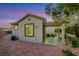 Backyard with detached casita including a covered patio and desert landscaping at 2873 Knoxville Ct, Henderson, NV 89052