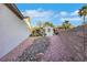Exterior view of the side yard with rock bed and detached casita in the background at 2873 Knoxville Ct, Henderson, NV 89052
