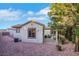 Exterior view of the casita with covered patio, landscaped yard and stone ground cover at 2873 Knoxville Ct, Henderson, NV 89052