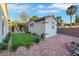 Casita exterior with artificial grass, desert landscaping, and low maintenance yard at 2873 Knoxville Ct, Henderson, NV 89052