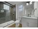 Bathroom featuring glass enclosed shower with brushed steel fixture and modern vanity at 2873 Knoxville Ct, Henderson, NV 89052