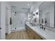 This dual sink bathroom is bright with a glass shower enclosure at 2873 Knoxville Ct, Henderson, NV 89052