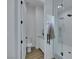 Bright bathroom with a glass enclosed shower, white vanity, and tiled shower at 2873 Knoxville Ct, Henderson, NV 89052