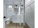 A tidy bathroom featuring a framed mirror, white cabinets, and modern fixtures at 2873 Knoxville Ct, Henderson, NV 89052