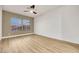 Bright bedroom with neutral walls, wood floors, and a ceiling fan at 2873 Knoxville Ct, Henderson, NV 89052