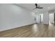 Spacious room with wood floors, white trim, and access to the bathroom and hallway at 2873 Knoxville Ct, Henderson, NV 89052